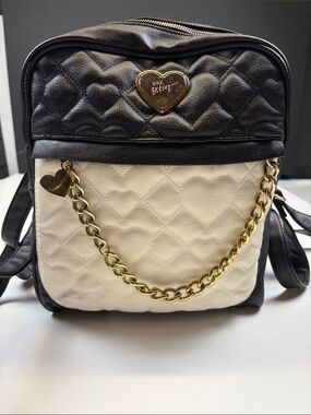 betsey johnson leather backpack Mighty Jungle Leopard Studly Bags, Wallets and Luggage A hidden internal pouch keeps personal items private while playful dots and strawberries add a fun pop of personality to your everyday carry Betsey Johnson Mini Backpack, Purse,